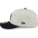 casquette-courbee-beige-et-bleue-marine-ajustee-59fifty-beads-na-lifestyle-f1-atlanta-braves-mlb-new-era
